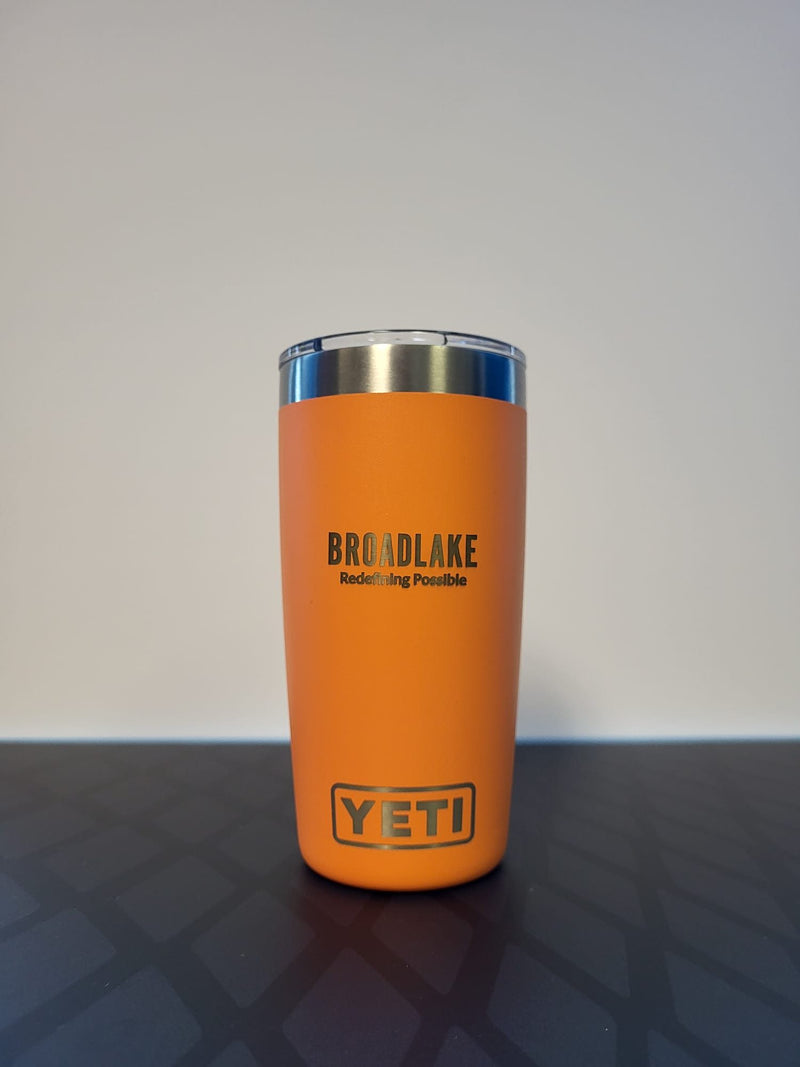 Broadlake logo on an orange YETI Rambler 10 oz tumbler