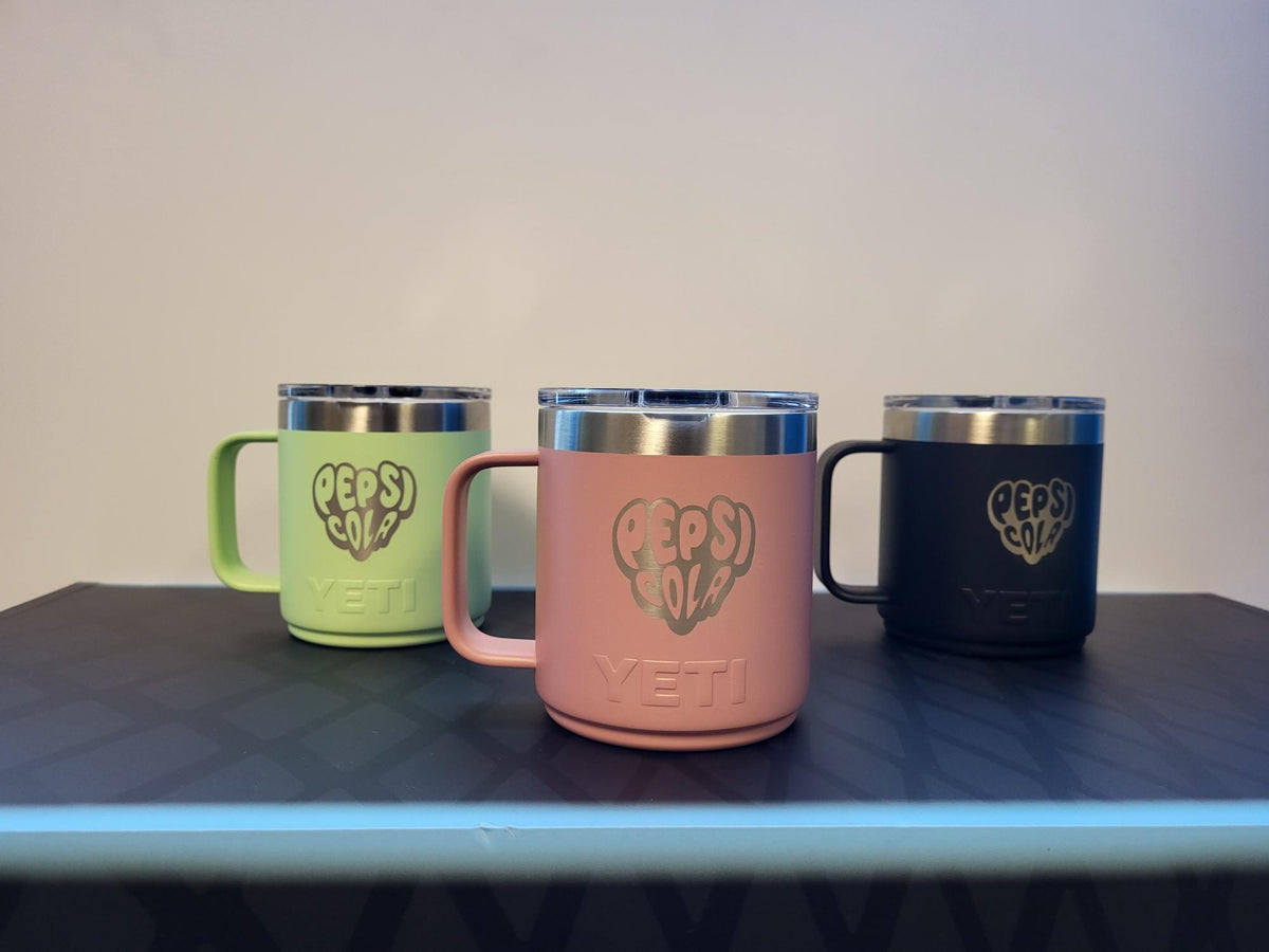 Pepsi heart logo on YETI Rambler mugs in three colours
