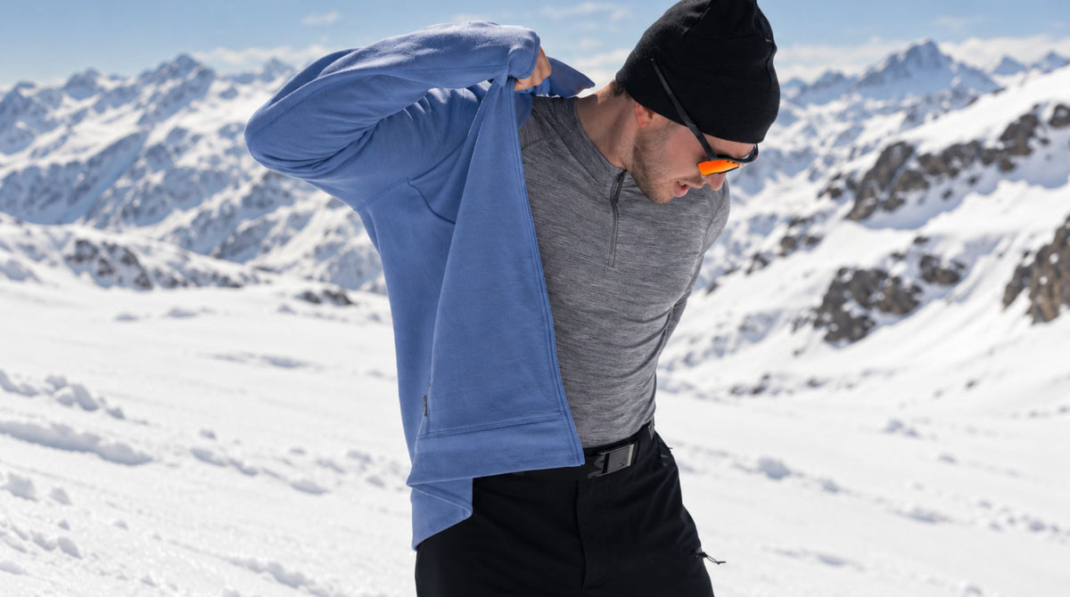 Someone putting on a base layer