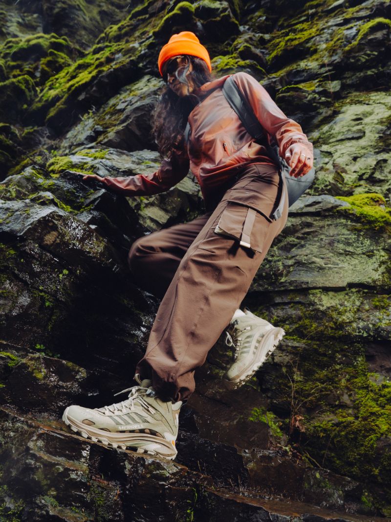 Close-up of a Merrell trail shoe on wet ground