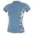 O'Neill Women's Side Print Short Sleeve Rash Guard Faded Denim/Palmento Tropical / X-Small-Faded Denim/Palmento Tropical / Small-Faded Denim/Palmento Tropical / Medium-Faded Denim/Palmento Tropical / Large-Faded Denim/Palmento Tropical / X-Large - 53 Degrees North 