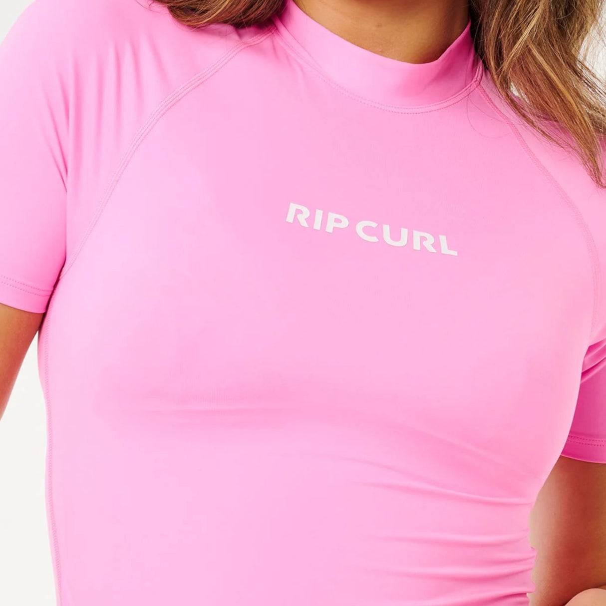 Ripcurl Women's Molokai Short Sleeve Solid UPF Rashguard Super Pink / X-Small-Super Pink / Small-Super Pink / Medium-Super Pink / Large-Super Pink / X-Large - 53 Degrees North 