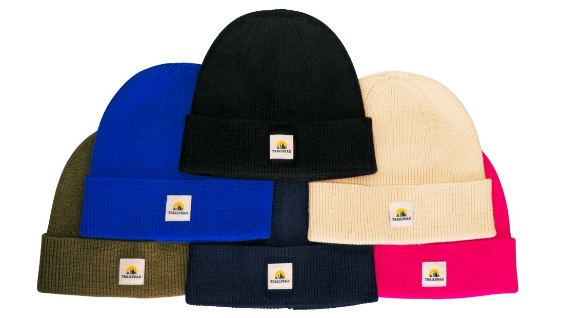 Five beanies in different colors with a brand logo on a white background