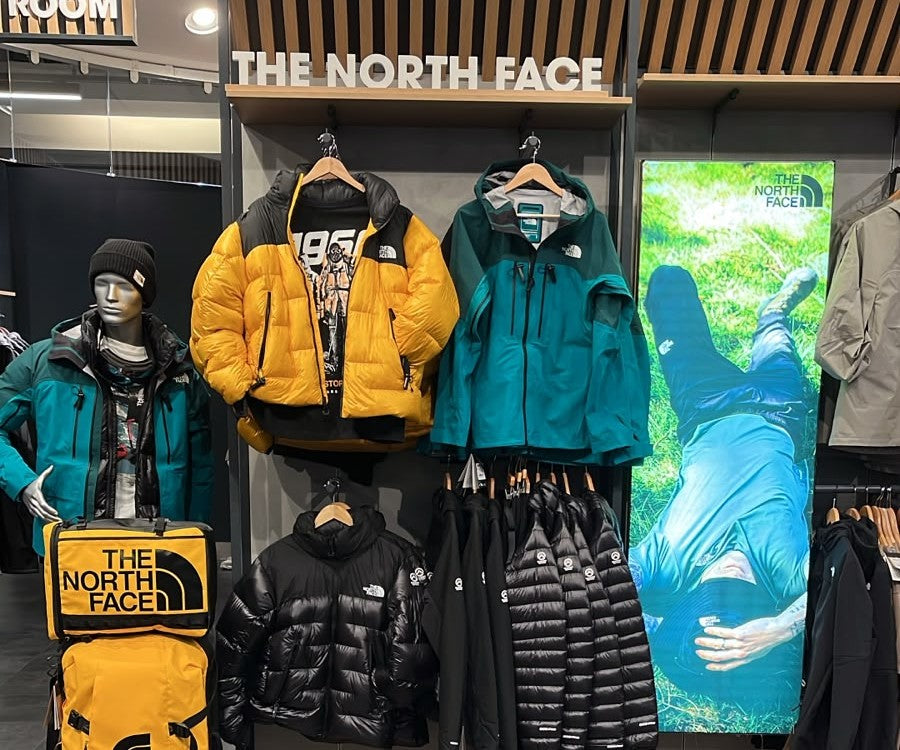 The North Face Nuptse jackets on The North Face wall at 53 Degrees North Arnotts