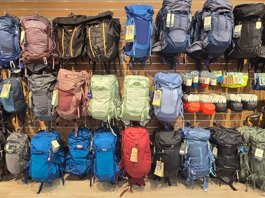 A wall of Osprey, Deuter and Vango backpacks to try on at 53 Degrees North Carrickmines