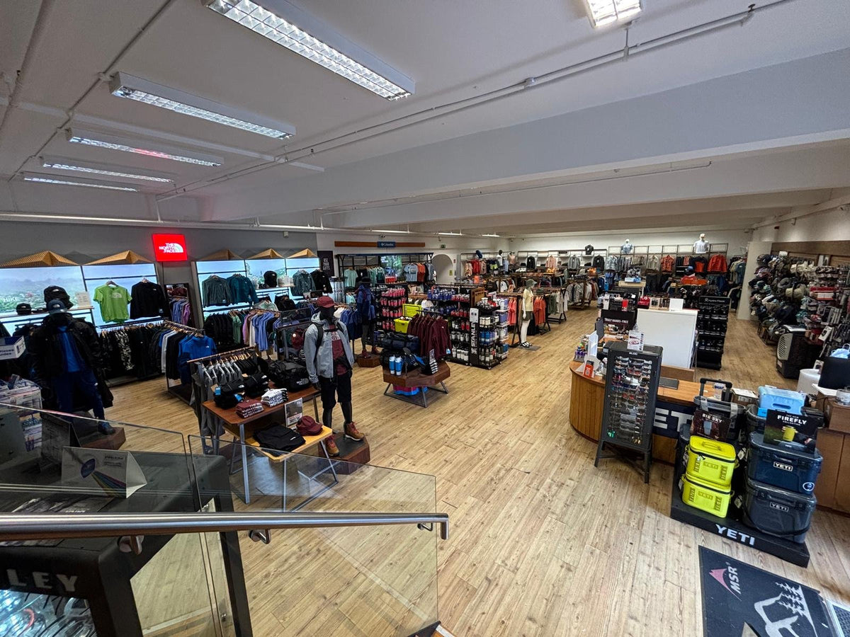 The shop floor at 53 Degrees North Cork seen from the stairs, with The North Face, Stanley and YETI