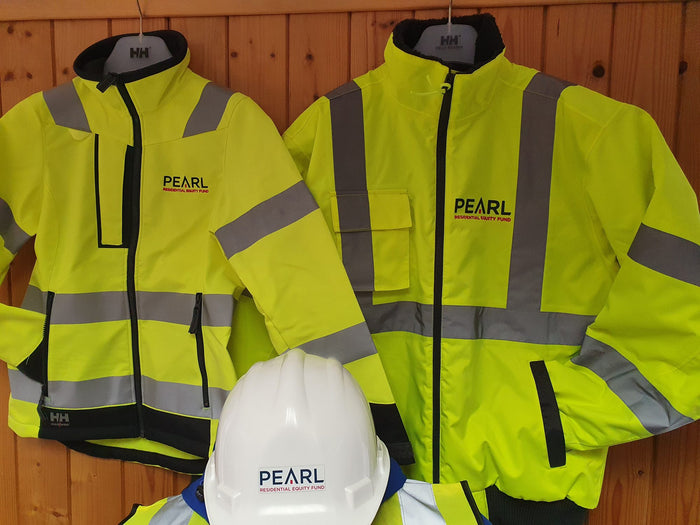 Pearl logo on Helly Hansen hi-vis jackets and a white hard hat